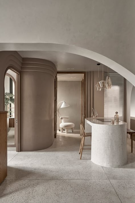 Limdim House Studio uses curved walls and arched niches in Vietnam apartment Curved Walls Interior, Curved Interior, One Wall Kitchen, Concrete Effect Paint, Interior Boho, Terrazzo Floors, Mocha Mousse, Studio Interior Design, Curved Walls