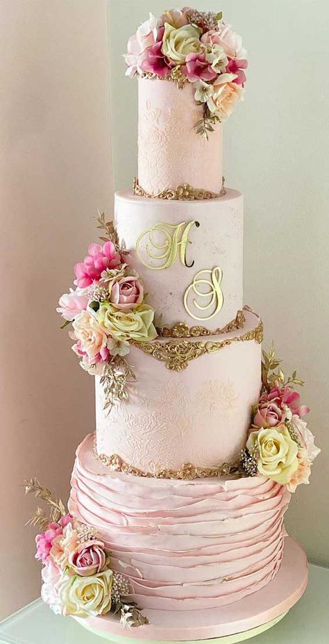 30. Gold and Pink Elegant Wedding Cake If traditional wedding cake isn’t what you are looking for, as we’re in year the year 2021,... Pink Theme Wedding Cake, Wedding Cake Ideas Elegant Blush Pink, Wedding Cake Pink And Gold, Xv Cakes Pink And Gold, Wedding Cake Pink Flowers, Concrete Wedding Cake, Geometric Wedding Cakes, White And Gold Wedding Cake, Quinceanera Cakes