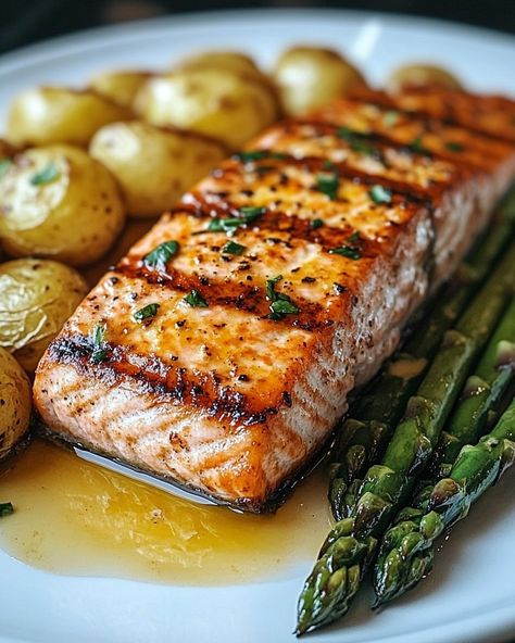 Savor the Flavors of Grilled Salmon with Roasted Potatoes and Cheesy Asparagus! 🍣🥔🧀 Ingredients: For the Grilled Salmon: • 4 salmon fillets • 2 tablespoons olive oil • Juice of 1 lemon • 2 cloves garlic, minced • 1 teaspoon dried dill • Salt and pepper to taste For the Roasted Potatoes: • 500 grams baby potatoes, halved • 2 tablespoons olive oil • 1 teaspoon paprika • 1 teaspoon garlic powder • Salt and pepper to taste For the Cheesy Asparagus: • 500 grams asparagus, trimmed • 1 tablespoon ol... Cooking Moodboard, Fall Party Food Ideas, Dill Salt, Cheesy Asparagus, Salmon Grilled, Fall Party Food, Dried Dill, Breaded Shrimp, Mini Potatoes