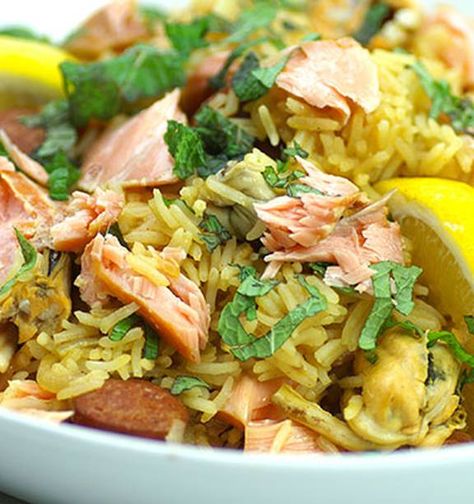 Spanish salmon paella - Eat Well Recipe - NZ Herald Salmon Paella, Spanish Salmon, Paella Recipes, Eating Well Recipes, Grain Recipes, Popular Dishes, Paella Recipe, Chorizo Sausage, Spanish Cuisine