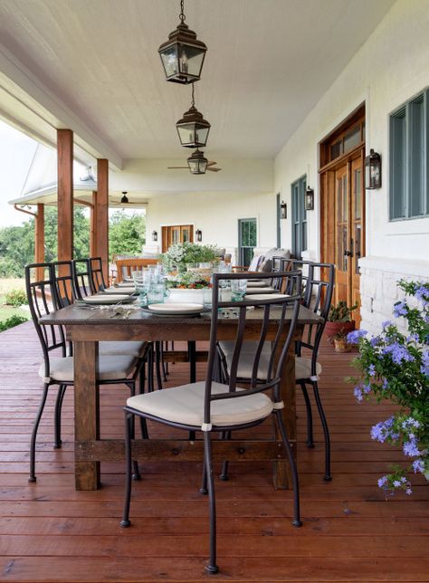 Large outdoor dining table and chairs on a covered porch in Texas Texas Front Porch, Southern Beach House, Beach House Porch, Southern Porches, Outdoor Gathering Space, Houston Interior Designers, Outdoor Gathering, Texas Ranch, Live Edge Coffee Table