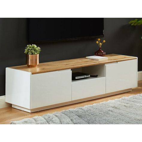 Mobilier d'intérieur > Meuble de salon > Meuble TV KAUF-UNIQUE, Le meuble TV contemporain AMANI s'accordera parfaitement à une décoration minimaliste tout en lui apportant une touche de chaleur grâce à son plateau coloris chêne. Pratique, il dispose de plusieurs espaces de rangements fermés et ouverts. N'hésitez plus, ce meuble sera votre allié pour vous détendre et profiter de votre intérieur. Caractéristiques: Structure: MDF Coloris : Blanc et chêne Finition : Laquée Plateau coloris chêne 2 po Tv Stand Decor Living Room, Hifi Room, Modern Tv Unit Designs, White Dressing Tables, Modern Tv Wall Units, Tv Unit Decor, Mounted Cabinet, Tv Stand Decor, Wall Tv Unit Design