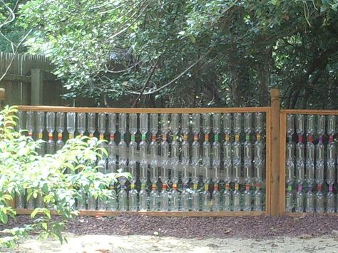 Creativity abounds!!                                                                                                            Karl Conrad Plastic Bottle Fence 2             by        RecycleMoreNC      on        Flickr Bottle Fence, Plastic Bottle Greenhouse, Green Fence, Fence Doors, White Fence, Steel Fence, Front Yard Fence, Bamboo Fence, Bottle Garden