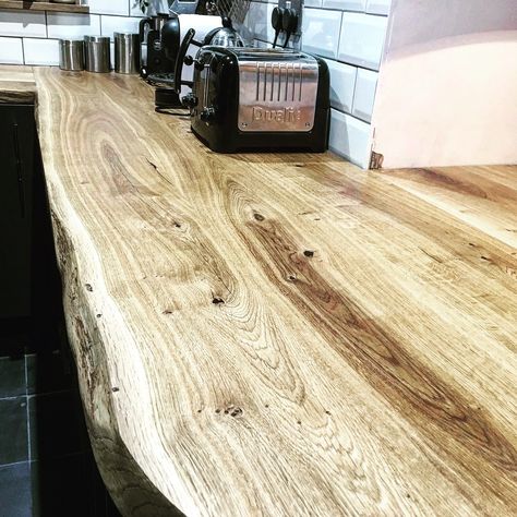 Earthy Oak Worktops with live edges, natural rustic features enhanced with clear resin, project location: London. For prices of our unique, handcrafted to order in Sussex wooden tops please visit our ONLINE SHOP on www.timberdeal.co.uk #earthyworktops #liveedgeworktops #naturaledgeworktops #kitchenworktops #customworktops #bespokeworktops #oakworktops #rawedgeworktops #waneyedgeworktops #waneyedgeworktop #worktopmanufacturer #worktops #worktopssussex #naturalwoodworktop #woodenworktops Wooden Kitchen Countertops Rustic, Wood Worktops Kitchen, Wooden Kitchen Worktop, Wooden Top Kitchen, Wooden Worktop Kitchen, Rustic Oak Kitchen, Wood Worktop Kitchen, Solid Wood Kitchen Worktops, Statement Island