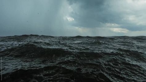 Rain falling on the surface of the water on a dark stormy day as seen from from eye level while swimming in the waves. Ocean Grunge, Obx Fanfic, Dark Nautical, Scary Ocean, Dark Waves, Dragon Aesthetic, Rain Falling, Dark & Stormy, Aesthetic Ocean