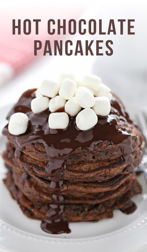 Hot Chocolate Pancakes feature rich chocolate buttermilk pancakes with a thick chocolate fudge topping and garnish with mini marshmallows. Perfect for Christmas morning! #hotchocolate #pancakes #chocolate #cocoa #christmas #newyears #holidays #baking #dessert #recipe #food #handletheheat #christmasdesserts #hotcocoa #chocolatepancakes #hotchocolatepancakes #christmasbreakfast #christmasmorning #breakfast #brunch Hot Chocolate Pancakes, Fudge Topping, Chocolate Fudge Topping, Pancakes Chocolate, Yummy Pancake Recipe, Christmas Breakfast Recipe, Chocolate Pancakes, Tasty Pancakes, Fudge Sauce