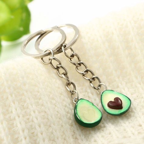 A pair of key rings which are shaped (and I mean this) like avocado halves. 13 Products That Are Perfect For Long-Distance BFFS Clay Key Chains, Keychain Couple, Connected Hearts, Clay Keychain, Fruit Jewelry, Jewelry Cute, Clay Craft, Keychain Set, Craft Shop