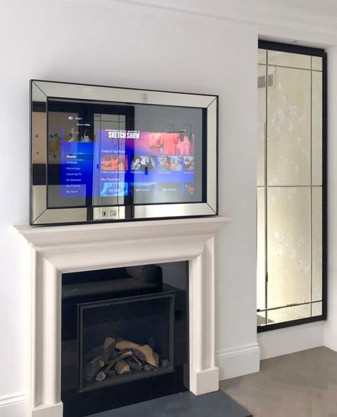 A contemporary frame with inset mitred glass panels - swipe to see the TV turned on! A remarkable example of modern style mirrors combined with modern technology and craftmanship ⁠ ⁠ #mirror #contemporarymirror #overmantels #swipetoseechange #interiordesign #design #homeloving #modernstyle #homedecor #tvmirror Mirror Tv, Contemporary Mirror, Contemporary Frames, Home Entertainment, Modern Technology, Glass Panels, Modern Style, Modern Design, Tv