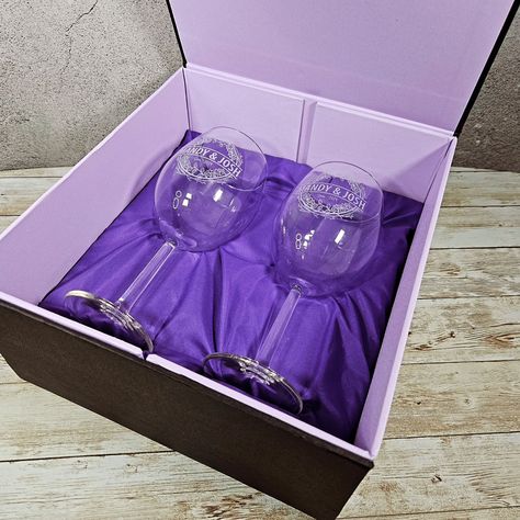 👰🤵✨ Unveiling a touch of elegance with our latest creation! This magnetic gift box bundle is not just a gift; it's a keepsake for those everlasting memories. Personalized wine glasses waiting to toast to the love and union of a special couple. Are you ready to make their wedding gift as unique as their love story? 🥂💝 #WeddingGiftGoals #CustomizedElegance #ToastToLove #EngravingGifts #coupleglass #engravingwineglass #weddingGifts #PersonalizedGift Purple Champagne Glasses, Magnetic Gift Box, Personalized Wine Glasses, Personalized Wine, Wine Glasses, Wedding Gift, Wine Glass, Love Story, Wedding Gifts