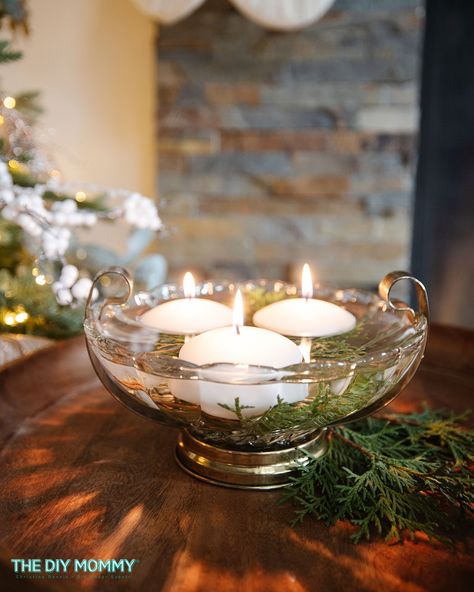 Floating Candles Centerpiece Idea from a Thrift Store Bowl | The DIY Mommy Floating Candle Bowl Centerpieces, Floating Candles Centerpiece, Floating Tea Candles, Floating Candle Centerpieces Diy, Diy Christmas Centerpieces, Wine Glass Centerpieces, Diy Floating Candles, Christmas Candle Centerpiece, Floating Candles Bowl