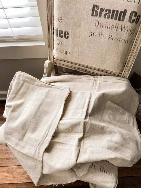 How To Make Vintage Inspired Feed Sack Fabric | Hometalk Round Side Table Makeover, Diy Upholstered Storage Bench, Repurposed Antiques, Deconstructed Chair, Drop Cloth Projects, Coffee Bean Sacks, Coffee Bean Bags, Side Table Makeover, Black Chalk Paint