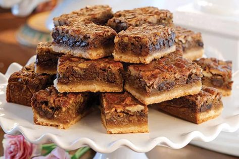 Celebrating the Derby with these simple and delicious Kentucky Derby Bars. Much like Derby Pie, these bars are packed with traditional elements like butter, eggs, pecans, and of course, chocolate. Kentucky Derby Pie Bars, Kentucky Derby Bars, Derby Bars, Derby Pie Bars, Kentucky Derby Pie, Pecan Pie Brownies, Derby Pie, Pecan Pie Bars, Pie Bars