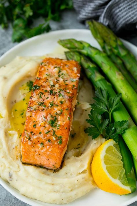 A pan seared salmon fillet served with mashed potatoes and asparagus. Salmon Garlic Butter, Salmon Garlic, Salmon Recipe Pan, Seared Salmon Recipes, Salmon Recipes Pan Seared, Salmon Recipes Baked Healthy, Garlic Butter Salmon, Marinated Salmon, Butter Salmon