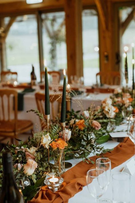 Terracotta And Green Centerpieces, Green And Burnt Orange Wedding Theme, Burnt Orange Table Runner Wedding, Dark Orange And Sage Green Wedding, Centerpieces Wedding Burnt Orange, Green And Orange Wedding Table Decor, Burnt Orange Centrepiece, Sage Green And Burnt Orange Wedding Bouquet, Green White Burnt Orange Wedding