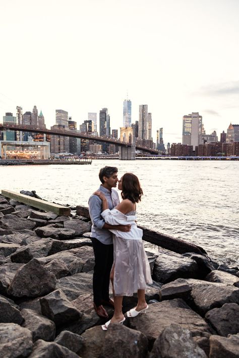 Romantic photo of couple standing at Pebble Beach during DUMBO engagement session in Brooklyn, NYC Dumbo Brooklyn Bridge, Dumbo Engagement Photos, Brooklyn Bridge Engagement Photos, Engagement Photo Shoot Poses, Photography Timeline, City Dog, Wedding Photoshoot Poses, Photos With Dog, Photo Booth Rental