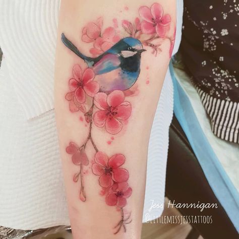 Fun native fairy wren and blossoms. Love the placement of this! Wraps around the arm. My client is a chef so we avoided all her high traffic areas 😊😊😊😎😍 Thank you! #wctattoo #watercolourtattoo #watercolortattoo #fairywren #blossoms #tattoo2me #tattoo #adelaide #australia #melbourne #emergingartist #artdaily #artist #makersmark #makersmovement #makersunite #oztattskincare Corgi Tattoo, Robin Tattoo, Celtic Cross Tattoos, Fairy Wren, Dandelion Tattoo, Small Flower Tattoos, Tatuaje A Color, Bird Tattoo, Phoenix Tattoo