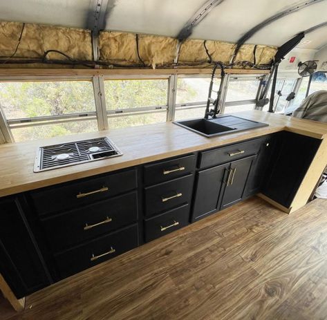 Bus conversion kitchen with 3 burner stove and granite composite sink and tons of storage Schoolie Kitchen, Skoolie Kitchen Ideas, Bus Kitchen Ideas, Bus Conversion Kitchen, Bus Conversion Layout, Skoolie Kitchen, Bus Build, School Bus Camper, Granite Composite Sinks