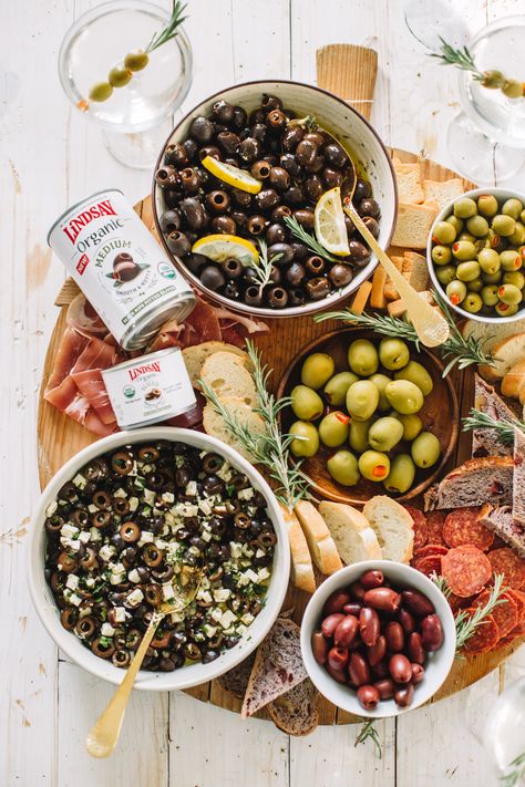 From Christmas to New Year’s and olive the moments in between 😉🌿 I love a good holiday snack bar set up. Today I’m teaming up with @lindsayolives to create an olive bar setup featuring h: Citrus Rosemary marinated olives, Olive and feta bruschetta, Kalamata Olives, Manzanilla Olives, Super Colossal Queen Olives, Prosciutto, Salami, Baguette, and more!  Happy Holidays 🎄#ad #LindsayOlives #NoBoringBites #appetizer #olives #olivebar #holidayappetizer #easyappeitzer Olives Aesthetic Food, Olive Party Decor, Olive Bar Ideas, Olive Themed Party, Olive Appetizers, Holiday Snack Bar, Olive Board, Feta Bruschetta, Olive Platter