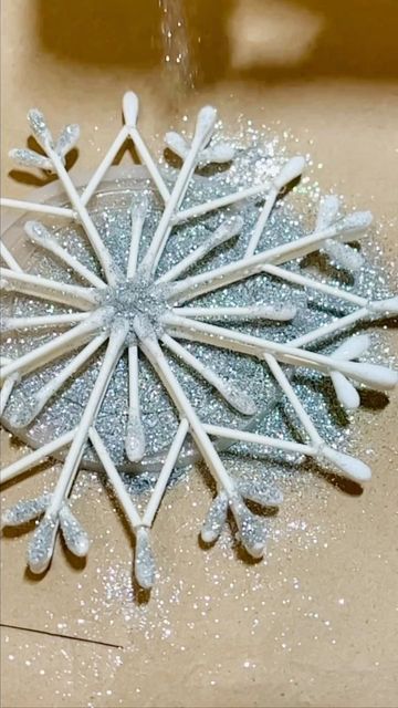 Seema on Instagram: "DIY Christmas decor : snowflakes ❄️❄️ Very simple and easy DIY. Material used : Ear bud /cotton swabs Hot glue gun Silver sparkles Decorating your house in your favorite festival with your own DIYs gives you an immense pleasure and satisfaction🥰 here is my way of doing it. Hope you all will get some idea? 💚 💚 💚 💚 💚 💚 #myhome_myedits #christmas #festive #diy #craft #snowflakes #reuse #decor #christmasdecor #hgtv #diyhomedecor #festiveseason #apartmenttherapy #diy Diy Christmas Decorations Indoor, Hot Glue Snowflakes, Cotton Bud Snowflakes, Christmas Decor Ideas Indoor, Dyi Snowflakes, Glue Snowflakes, Snowflakes Diy, Snowflake Diy, Snowflake Ornaments Diy Kids