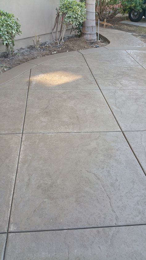 Stamped Cement Patio Ideas Backyard, Brown Stamped Concrete Patio, Brickform Concrete Colors, White Stamped Concrete, Patio Concrete Ideas, Stamped Concrete Front Porch, Textured Concrete Patio, Concrete Flooring Ideas, Tile Alternatives