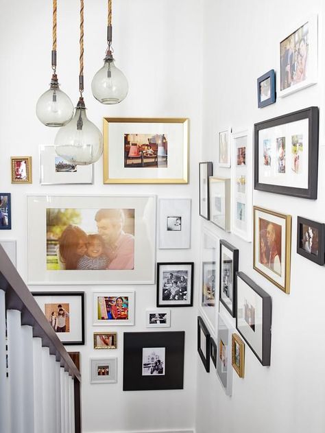 Try a gallery of photos in varying sizes #hgtvmagazine http://www.hgtv.com/decorating-basics/when-emily-henderson-designs-your-home/pictures/page-3.html?soc=pinterest تحت الدرج, Gallery Wall Staircase, Emily Henderson Design, Stairway Decorating, Display Family Photos, Eclectic Gallery Wall, Gallery Wall Inspiration, Design Del Prodotto, A3 Size