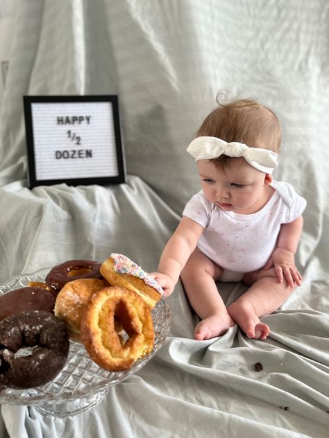 Photo is of a baby with a sign that reads half dozen and 6 donuts on a platter in front of them set up with a blanket back drop 6 Month Donut Pictures, 6 Month Donut Photoshoot, Half A Dozen Donuts For 6 Months, 6 Months Old Photo Ideas, Donut Pictures, Diy Photoshoot, 2nd Birthday Photos, 1 Month Baby, Local Cafe