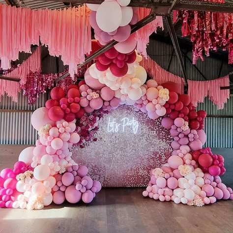 Bring glitz and glam to the party decor by setting up a fabulous backdrop and make your guests WOW. Exude a rejuvenating vibe by designing a ritzy backdrop using blush sequin wall with “Let’s Party” light sign and add extra pizzazz by pepping it with a fuchsia, pink, & blush balloon garland and insert blush wisteria vines for a striking display. Create a vibrant ceiling decor by hanging fuchsia fringe foil curtains along with blush paper streamers and make your party look aesthetically attractiv Streamer Wall, Shimmer Wall Backdrop, Curtains Floral, Sequin Wall, Bridal Shower Balloons, Backdrop Decor, Shimmer Wall, Prom Decor, Fringe Backdrops