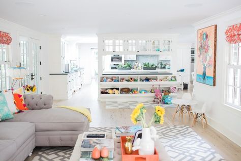 View of the custom play area of Eva Amurri Martino's family room in connecticut featuring built in toy storage and an open floor plan Play Zone In Living Room, Fun Family Room Ideas, Living Room Decor Kid Friendly, Play Area In Living Room, Kid Friendly Family Room, Family Room Playroom, Family Room Storage, Family Room Reveal, Living Room Toy Storage