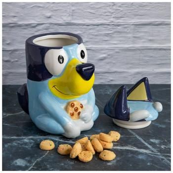 Dimensions: 5.3" x 6.73" 9.5" Volume: 0.4 Gallons Opening Diameter: 3.5" Material: Ceramic Color: Blue, Brown, White & Yellow Care & Safety: Hand Wash Only Quantity: 1 Keep your treats safely contained in this Sitting Bluey Cookie Jar. This ceramic container features the cute and cuddly character Bluey sitting with a cookie in hand. The top of her head, including her ears and eyebrows, are the lid of the jar. Display this cute treat holder on your counter for a fun, kid friendly atmosphere! Bluey Merch, Bluey Stuff, Snack Containers, Kitchen Dinnerware, Treat Holder, Cute Cookies, Cat Nap, Cookie Jars, Christmas Wishlist