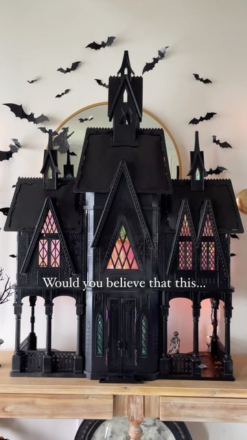 Heather Young on Instagram: "Some Halloween magic 🖤 . Run or take your broom, don’t walk to Facebook Marketplace and search “Elsa castle” or any dollhouse and you’ll have yourself the perfect haunted house for Halloween decor! I got mine off Facebook marketplace and these castles are always on there! I just spray painted it black, added some cellophane wrap behind the windows and some orange string lights! . The bats are from Amazon and linked along with the sconces and entryway table! . #worldmarketfinds #diy #beforeandafter #halloween #howihome #myhome #myhomevibe #interiordesign #halloweencrafts #entryway #spookyseason #spooky #halloweendollhouse #bats" Dollhouse Haunted House Diy, Halloween Doll House Diy, Spooky Doll House, Spooky Dollhouse Diy, Diy Haunted House Dollhouse, Dollhouse Repaint, Halloween Dollhouse Diy, Diy Haunted Dollhouse Ideas, Dollhouse Haunted House