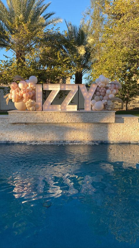 Custom color balloon garland on marquee letters Huge Balloon Garland, Quince Pool Party Ideas, 21st Birthday Pool Party Ideas, Sweet 16 Balloon Garland, 18th Bday Pool Party Ideas, Pool Party Blue Theme, Preppy Balloon Arch, Gold Pool Party, Floating Letters For Pool