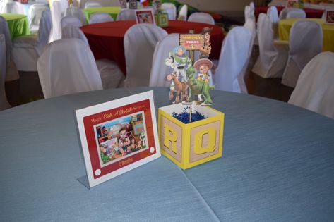 Table Decor Toy Story, Toy Story Gift Table, Toy Story Theme Centerpieces, Easy Toy Story Centerpieces, You Story Centerpieces, Toy Story Guest Book, Toys Story Centerpieces, Toy Story Table Decorations Centerpieces, Toy Story Birthday Centerpieces Diy