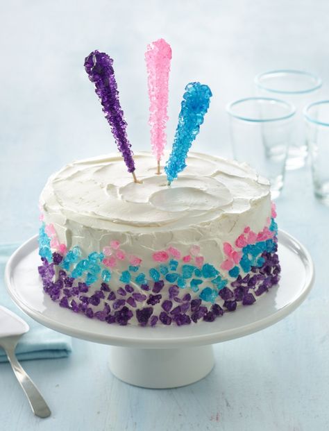 Feather-light meringue frosting gives this festive cake undeniable allure. Look for colored rock candy at candy or craft stores or online! Gemstone Birthday Cake, Gem Birthday Cake, Gem Stone Cake, Rock Candy Cupcakes, Rock Candy Cake, Rock Candy Birthday Cake, Cake With Crystals Rock Candy, Rainbow Geode Cake, Crystal Cupcakes Rock Candy