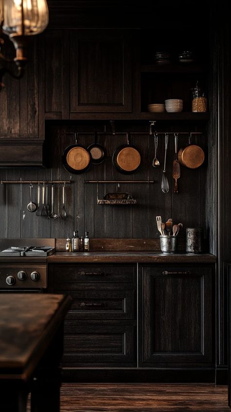 Rustic dark wood kitchen cabinets with vintage hardware, hanging utensils, and aged black walls create a warm, inviting Sapele Kitchen Cabinets, Kitchen Night Aesthetic, Manly Kitchen, Dark Academia Kitchen, Cabinet Trends, Moody Kitchen, Cozy Dinners, Kitchen Cabinet Trends, Brown Kitchen Cabinets