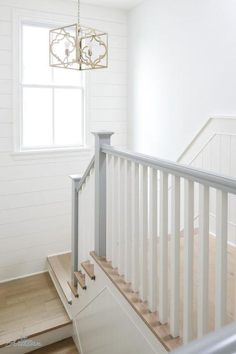 A staircase combines dove gray and natural wood floors with gold accents. Gray Wood Floors Bedroom, Painted Banister Ideas, Gray Wood Floors, Grey Wood Floors Bedroom, Painted Banister, Banister Ideas, Stairs Handrail, Gray Stairs, White Staircase