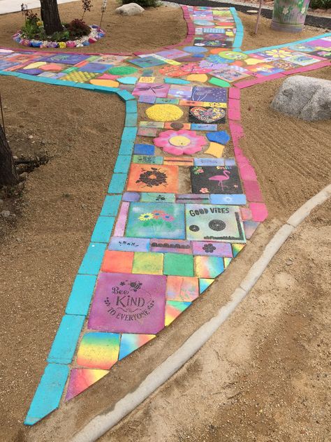 Painted steppingstone pathway Storybook Walk, Footpath Ideas, Dog Turf, Painted Stepping Stones, Diy Pathway, Stone Backyard, Backyard Movie Party, Preschool Playground, Painted Pavers