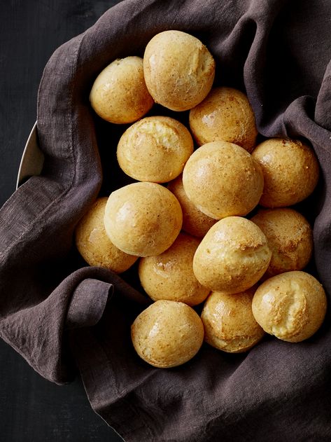 Pandebono | This simple bread is easy to prep (as it’s made in the food processor), and has a rich, cheesy flavor and soft, dense texture. Anejo is a firm, aged, sharp, and salty cheese traditionally made with goat’s milk, but is now commonly made with cow’s milk as well. It often has a red exterior from being rolled in paprika. Cuajada is a fresh, soft Colombian cheese with a smooth, creamy, and delicate texture. Combined, these cheeses give the pandebono its distinct flavor. Evening Coffee, Simple Bread, Farmers Cheese, Colombian Food, Tea Biscuits, Tapioca Flour, Cinnamon Swirl, Flour Recipes, Easy Bread