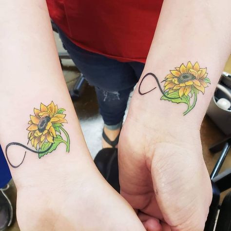 Mother daughter sunflowers  - - - - #sunflower #tattoos #inkedup #inked #tattooideas #tattooedgirls #flowers #wristtattoo #colortattoo #smalltattoo #raleightattoo #tattooed #flowertattoo Sun Flower Tattoos, Unique Owl Tattoo, Aria Tattoo, Mom Daughter Tattoo, Mother Daughter Infinity Tattoos, Mother Daughter Tats, Small Sunflower Tattoos, Foot Tattoo Ideas, Infinity Tattoo With Feather