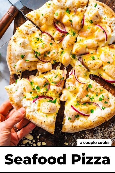 This seafood pizza is bursting with flavor, starring succulent shrimp and scallops, seasoned ricotta, and gooey mozzarella cheese. It’s a winner! Pop over to our site for the recipe! Ooni Pizza Dough, Seafood Delight, Ooni Pizza, Vegetarian Bbq, Seafood Pizza, A Couple Cooks, Mediterranean Diet Recipes, Pizza Toppings, Mozzarella Cheese