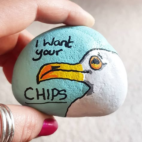 Rock painting by T. on Instagram: “Day 9 ocean... #paintedrocksareace a beach day is not complete without a pesky seagull.  #rainbowrocks #rockproject #rockingtheworld…” Rock Painting Ocean, Rock Painting Ideas Beach Theme, Beach Rock Art Ideas, Seagull Rock Painting, Rock Painting Ideas Ocean, Beachy Painted Rocks, Beach Painted Rocks Ideas, Shell Painting Ideas Seashells, Rock Painting Ideas Beach