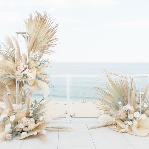 A seaside soiree 🏖️  This beachy floral arrangement is giving all the summer vibes 🌸 A perfectly curated mix of vibrant blooms in the sand - pure bliss! 😍  Just imagine saying "I do" here with the sound of waves in the background. A dreamy oceanfront wedding awaits! 🌊  Who's ready for a beach wedding? Sound off below! 👰💒  #weddingflowers #weddingflorist #freshflowers Beachy Flower Arrangements, Arch Flower Arrangement, Oceanfront Wedding, Long Stem Flowers, Flower Tower, Silver Dollar Eucalyptus, Display Risers, Floral Chandelier, Wire Flowers