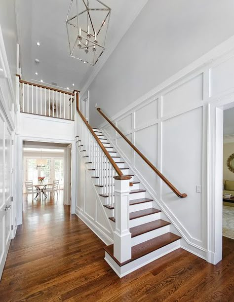 Decorating Bottom Of Stairs, Wainscoting In Entryway, Hallway Chandelier Stairways, Stair Wall Paneling, Hallway Chandeliers, Updated Stair Railing, Two Story Staircase, Foyer Molding, Foyer Staircase Entryway