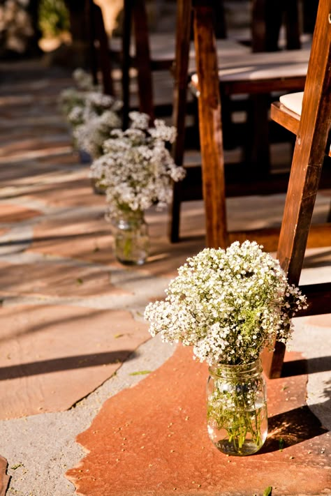 Mason Jar Isle Decorations, Outdoor Ceremony Simple Decor, Mason Jar Ceremony Aisle, Baby Breath Down The Aisle, Mason Jar Aisle Wedding, Baby’s Breath Aisle Decor, Mason Jar Aisle Decor, Simple Outside Ceremony Decor, Simple Outdoor Aisle Decor