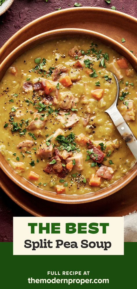 a bowl of homemade split pea soup with ham and bacon sprinkled with fresh parsley