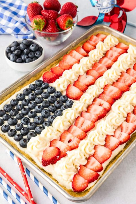 This delicious flag fruit pizza dessert is the perfect sweet treat for Fourth of July, Memorial Day, Labor Day, or any time you are feeling patriotic. Perfect for enjoying at a backyard bbq or potluck, this easy to make giant cookie is always the star of the table decorated like an American flag. Your family and friends will love how this dessert looks, and how the soft chewy cookie tastes! American Flag Dessert, Flag Fruit Pizza, Fruit Pizza Ingredients, Desserts Fourth Of July, Patriotic Fruit Pizza, Flag Desserts, Bbq Potluck, Easy Fruit Pizza, Pizza Dessert