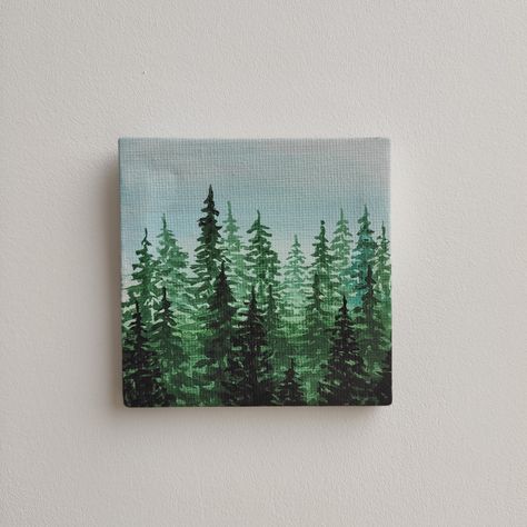 Original small 100% hand painted acrylic canva. Mini forest, Landscape. Spruces and pines painting, tree tops. NOT a print *Size 8x8x0.5 cm Canvas doek It’s painted on all sides, so it looks attractive from any angle. It is a perfect size to sit on your office desk. Great placing on a bedside table or bookcase. The small wooden easel is included. You can also hang up on your wall. It is a delightful gift for your loved ones. Thank You For Visiting My Shop Green Mini Paintings, Mini Canvas Forest Painting, Forest Painting On Canvas, Ivy Painting Acrylic, Forest Canvas Painting Easy, Mini Forest Painting, Mini Canvas Art Green, Small Christmas Painting Ideas, Wood Canvas Painting Ideas