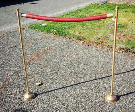 Lights! Camera! Action! A great way to decorate a red carpet themed party is to guide guests with fancy stanchions. If you search for stanchions online you can find that they are very expensive and they are very hard to find at a party store. So why not make your own?! You can make 3 stanchions with 2 ropes for about $9.50 without paint. It is very easy, if you have the right tools (drill and type of saw). Let's get started!You can follow me on Instagram @thisnameisnowchosen . :) Red Carpet Prom Theme, Diy Red Carpet, Covered Pool, Red Carpet Theme Party, Cheap Backdrop, Red Carpet Theme, Red Paint Colors, Hollywood Party Theme, Red Carpet Party