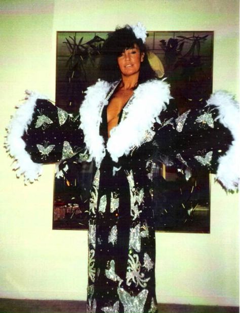 The late "Sensational" Sherri Martel wearing Ric Flair's robe Sherri Martel, Sensational Sherri, Wwe Total Divas, Women Wrestling, Ric Flair, Wwe Girls, Pro Wrestler, Wrestling Superstars, Dating Coach