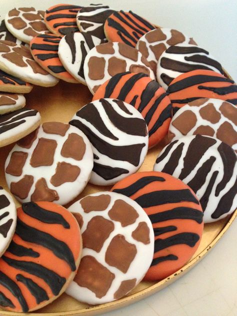 Animal print sugar cookies for Cam's 4th birthday party!  Copied designs from another pin of cupcakes Animal Print Cookies Decorated, Safari Birthday Party Cookies, Animal Print Cookies Royal Icing, Jungle Royal Icing Cookies, Two Wild Royal Icing Cookies, Safari Cookies, Jungle Theme Birthday Party, Zoo Birthday Party, Wild Birthday Party