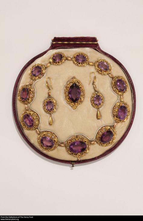 Necklace, Pendant and Earrings, circa 1865; amethyst, gold. Nineteenth-century women purchased jewelry in matching sets that were intended to be worn together. Full sets usually included a necklace, brooch, bracelet, and earrings. This partial gold and amethyst (purple quartz) set was probably paired with a low-cut evening gown and worn by a well-to-do lady around the time of the American Civil War. Spoon Jewelry Diy, Royal Crown Jewels, Georgian Jewelry, Kay Jewelry, Edwardian Jewelry, Historical Jewellery, Purple Quartz, Amethyst Gold, Royal Jewels